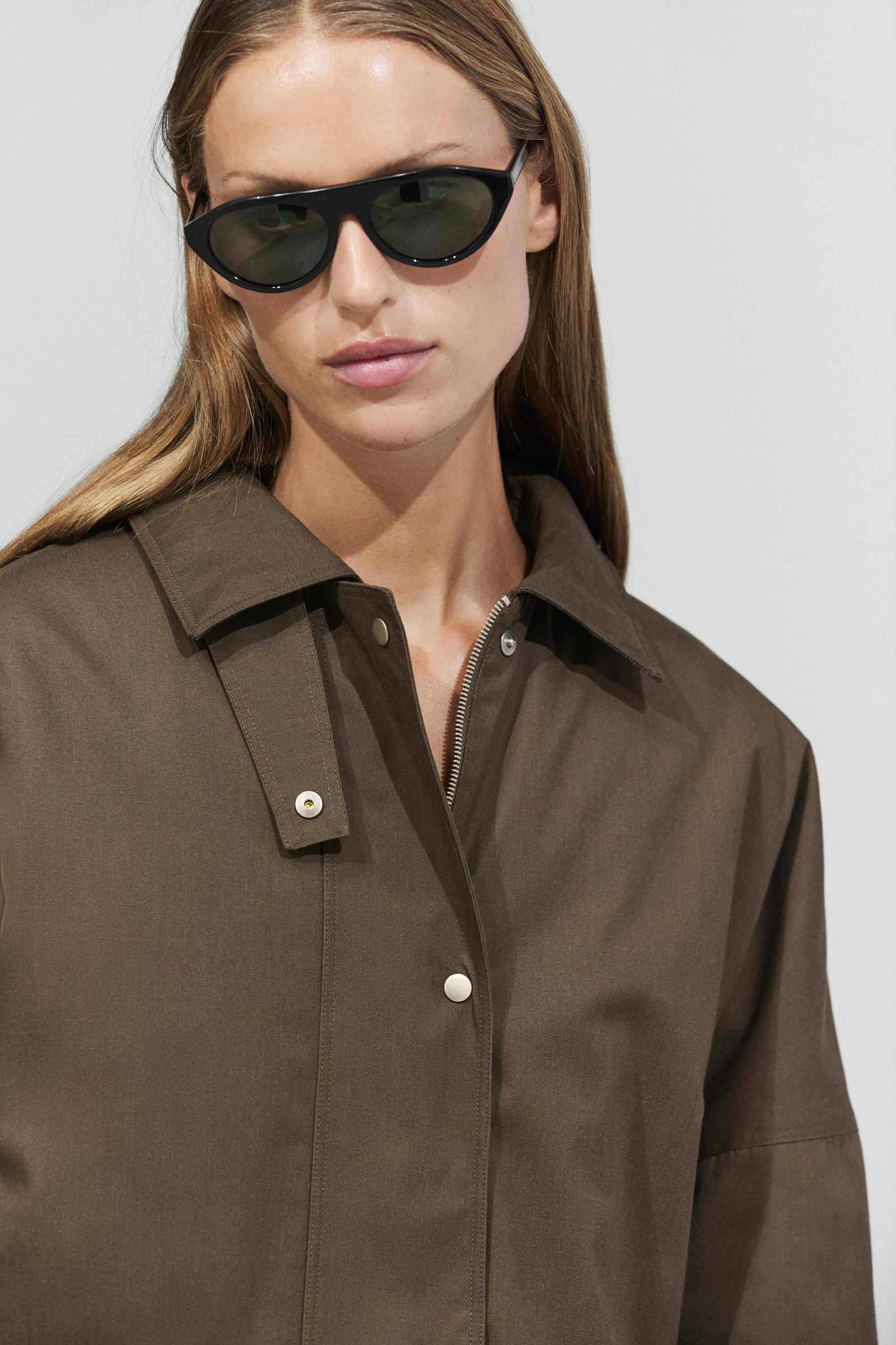 Waxed-effect parka with plaid lining